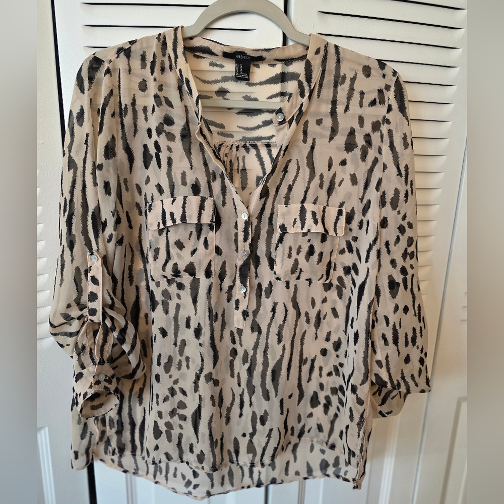 Forever 21 animal print blouse featuring roll-tab sleeves for versatile wear